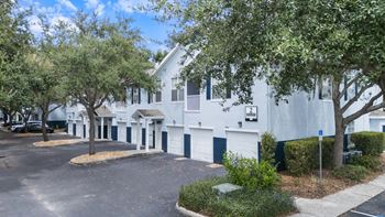 White building with a parking lot